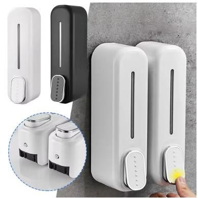 Manual press wall-mounted soap dispenser in white and black plastic for bathroom or kitchen use