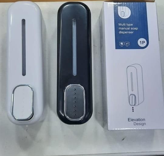 Two manual wall-mounted soap dispensers in black and white colors placed next to packaging box with elevation design illustration