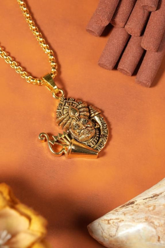 Golden Khatu Shyamji pendant with chain made of gold-plated stainless steel on a brown background