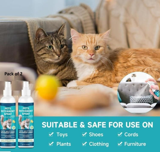 Pack of 2 pet deterrent spray bottles next to two cats on a sofa, with usage indications for toys, shoes, cords, plants, clothing, and furniture.