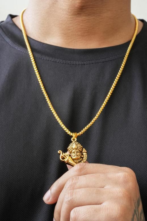 Golden Khatu Shyamji pendant with chain worn around neck, made of gold-plated stainless steel