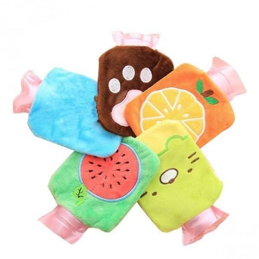 Colorful small hot water rubber bottles with soft plush covers in fruit and paw designs for pain relief therapy